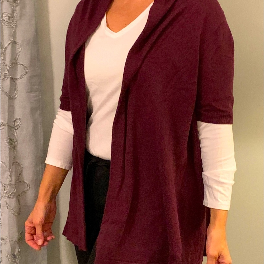 Short sleeved cardigan sweater.
